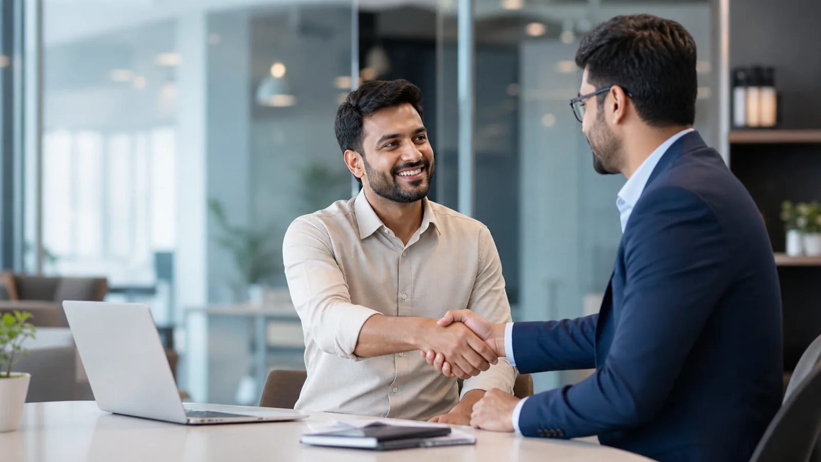Indian financial-services partners completing a professional handshake
